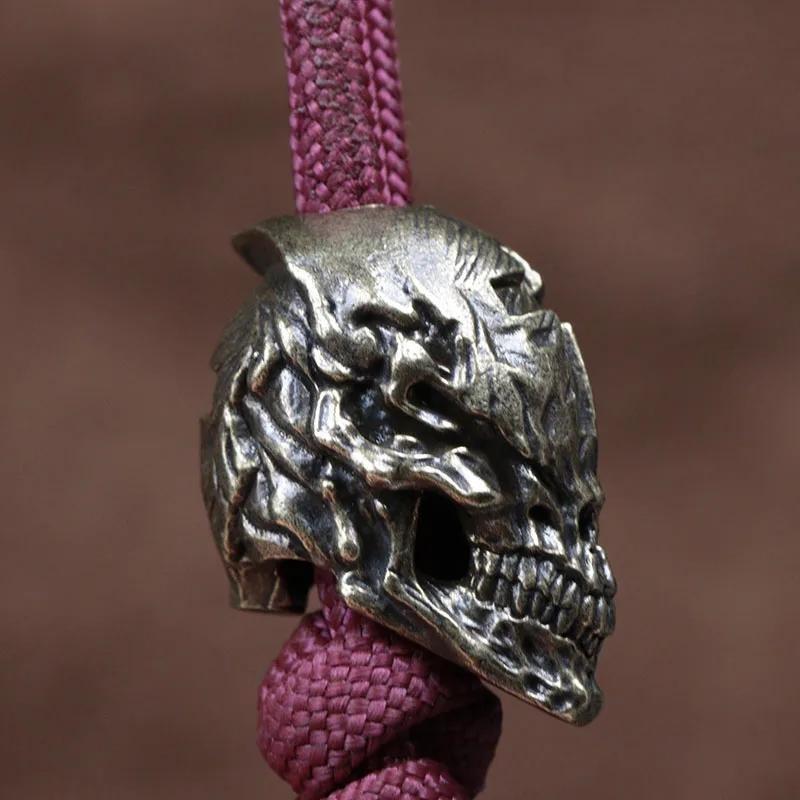 Cross Skull Head Mosazný nůž Korálky EDC DIY Paracord Tkané náramky Přívěsky na řetízky Příslušenství Venkovní závěsy na nářadí Tretky