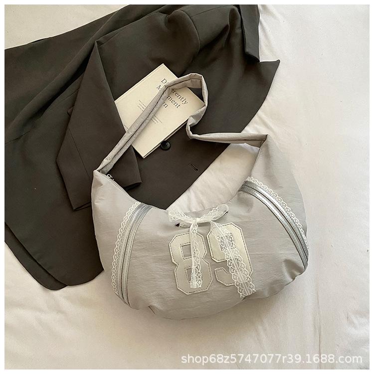 

Casual large-capacity crossbody bag women s bag 2025 new fashion canvas croissant bag design niche shoulder bag серый