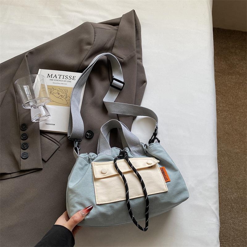 

2025 new contrasting color pleated shoulder bag nylon cloth casual versatile messenger bag large capacity lightweight bag women One size
