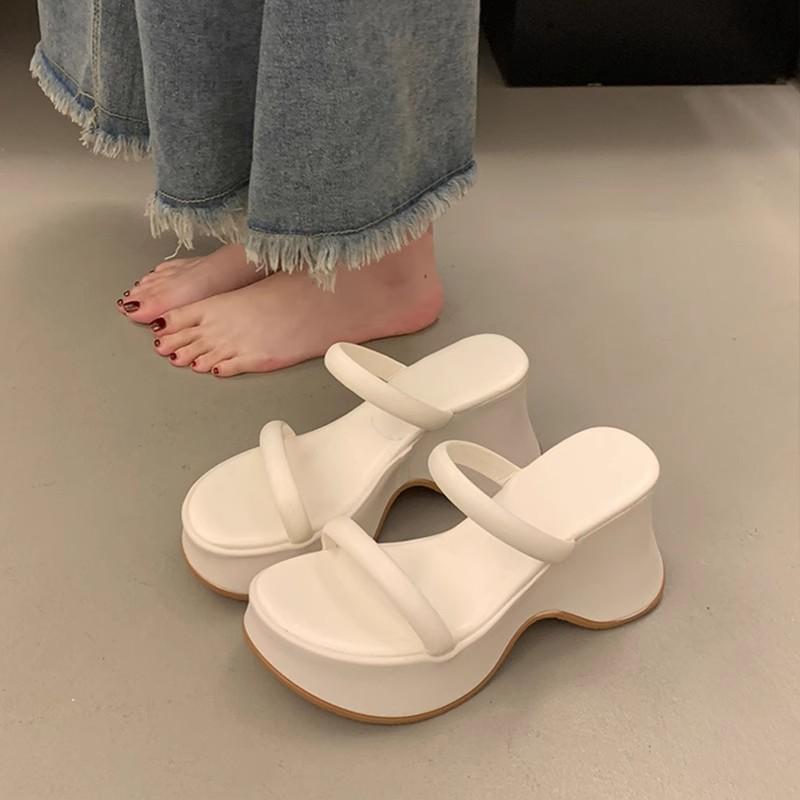 Temperament advanced sense one-word slippers women's summer wear new small thick-bottomed wedge heel high-heeled muffin slippers