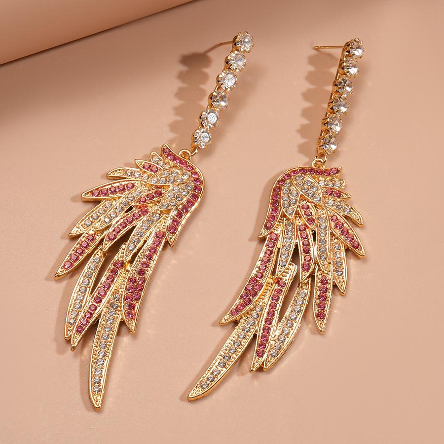 

Exaggerated personality diamond-set wings colored silver needle earrings light luxury niche temperament earrings