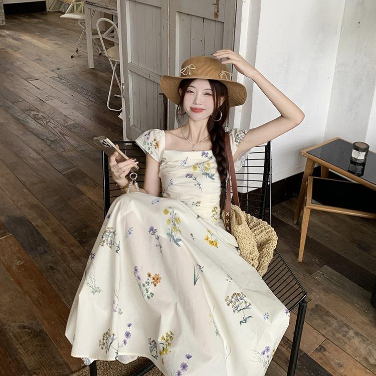 Xiaofei sleeve square neck floral dress children's summer 2026 new seaside vacation coffee break French temperament long dress