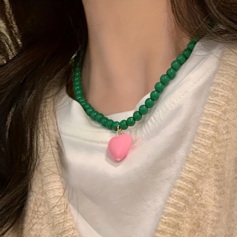 A Trendy New Colorful Bead Necklace Featuring a Unique Heart-Shaped Pendant, Perfect for Women Who Love Fashionable Handmade