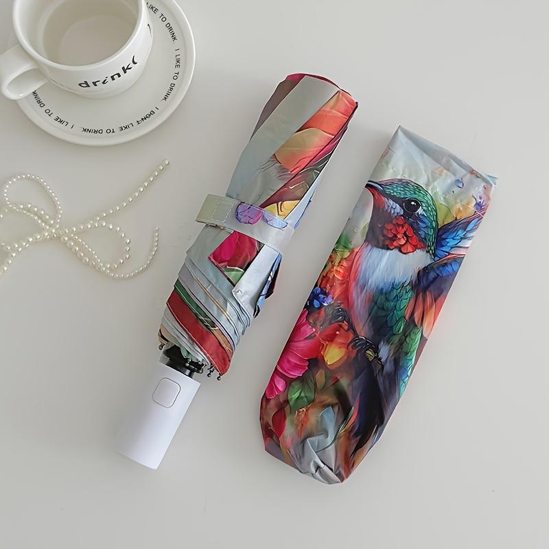A Vibrant Hummingbird And Floral Print Umbrella, Featuring Automatic Folding, And Shielding. This Sturdy And Durable Umbrella with Eight Rib