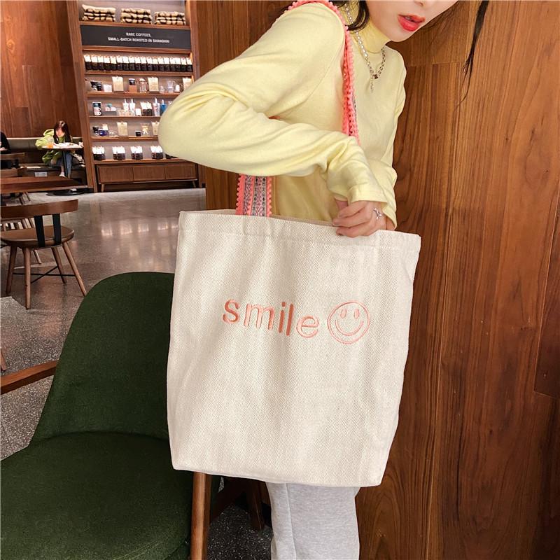 

Korean Embroidered Smiley Large Capacity Shoulder Bag Hairball Shoulder Strap Student Class Women s Canvas Bag Bag рожевий