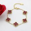 Bracciale da donna a fascia con conchiglia double-face e quadrifoglio, resistente ai colori, alla moda e di alta gamma