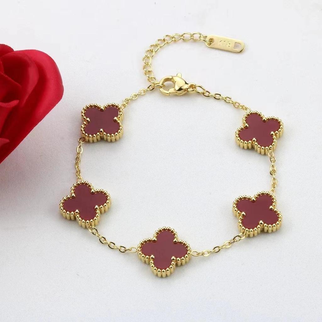 Bracciale da donna a fascia con conchiglia double-face e quadrifoglio, resistente ai colori, alla moda e di alta gamma