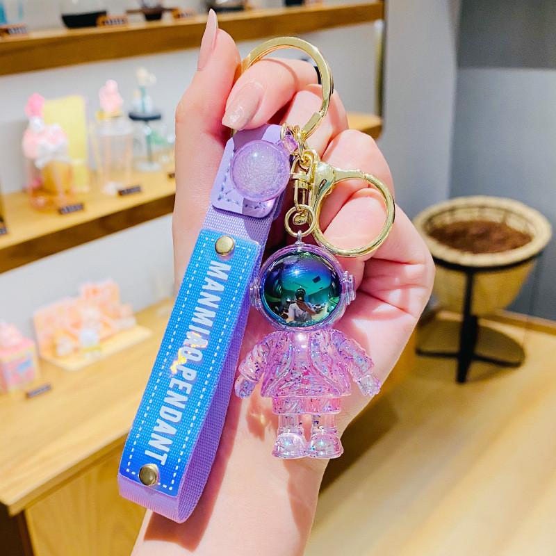 

Eyecatching Space Colorful Astronaut Keychain Resin Material Ideal For Promotional And Business Gifts фиолетовый