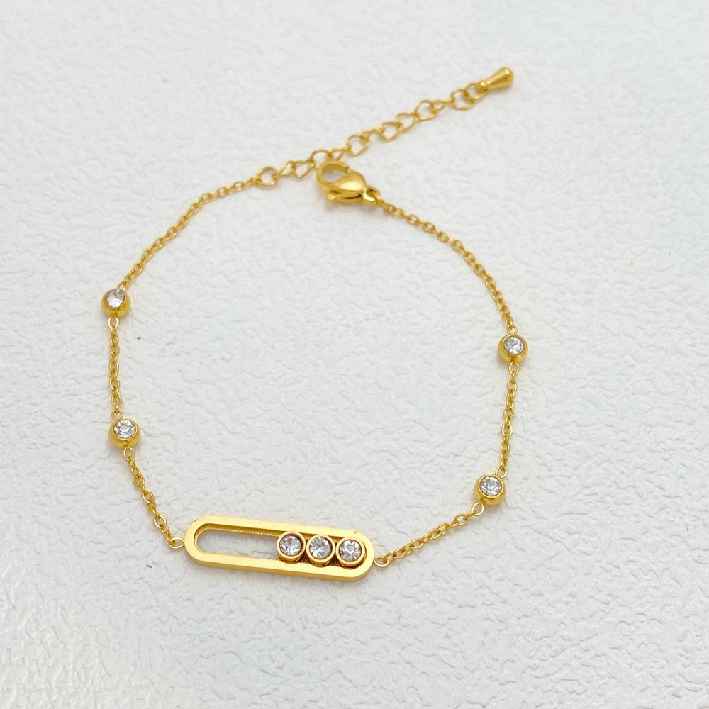 

Элегантный набор украшений из титановой стали со скользящими серьгами-бриллиантами, ожерельем и браслетом: Высококлассный, Модный Дизайн для Женщин.