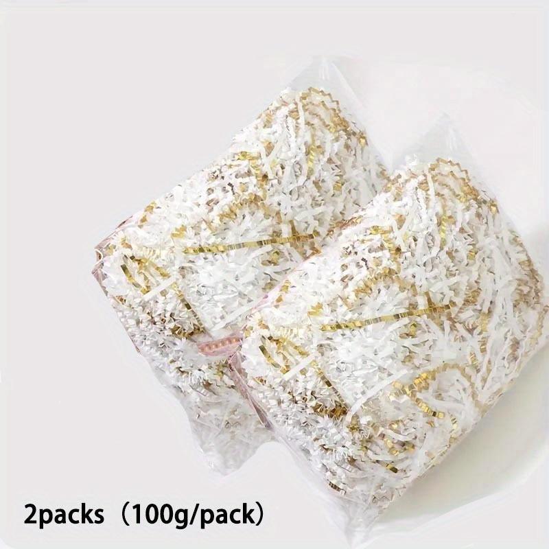 

2упаковки (100г/упаковка) Двусторонний наполнитель для подарочной коробки из золотистой гофрированной бумаги и шелка с соответствующими аксессуарами из рафии