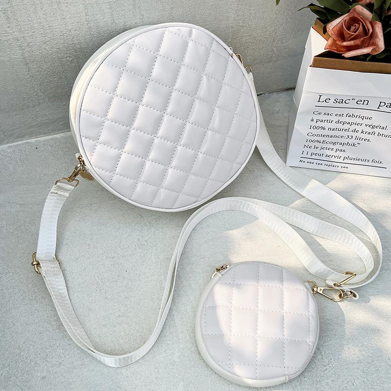 Bag women's new solid color rhombus embroidered messenger small round bag with change small bag fashionable one