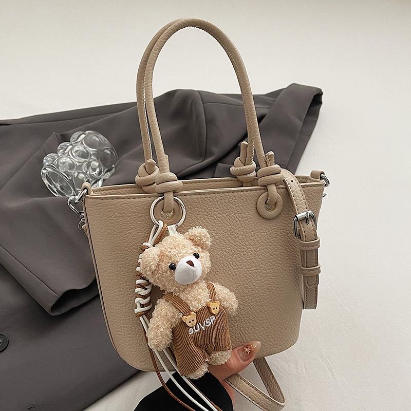 Wholesale hot sale high quality casual lychee pattern solid color portable bucket bag versatile simple wind commuter messenger bag women