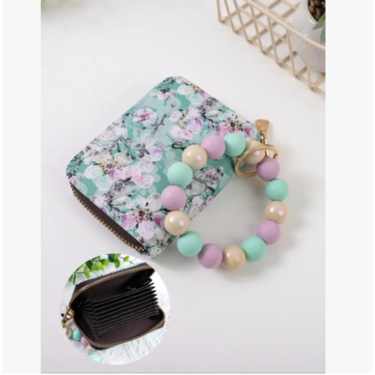 

A minimalist-style accessory, handcrafted from marble-patterned silicone beads: a women s wallet and card holder рожевий