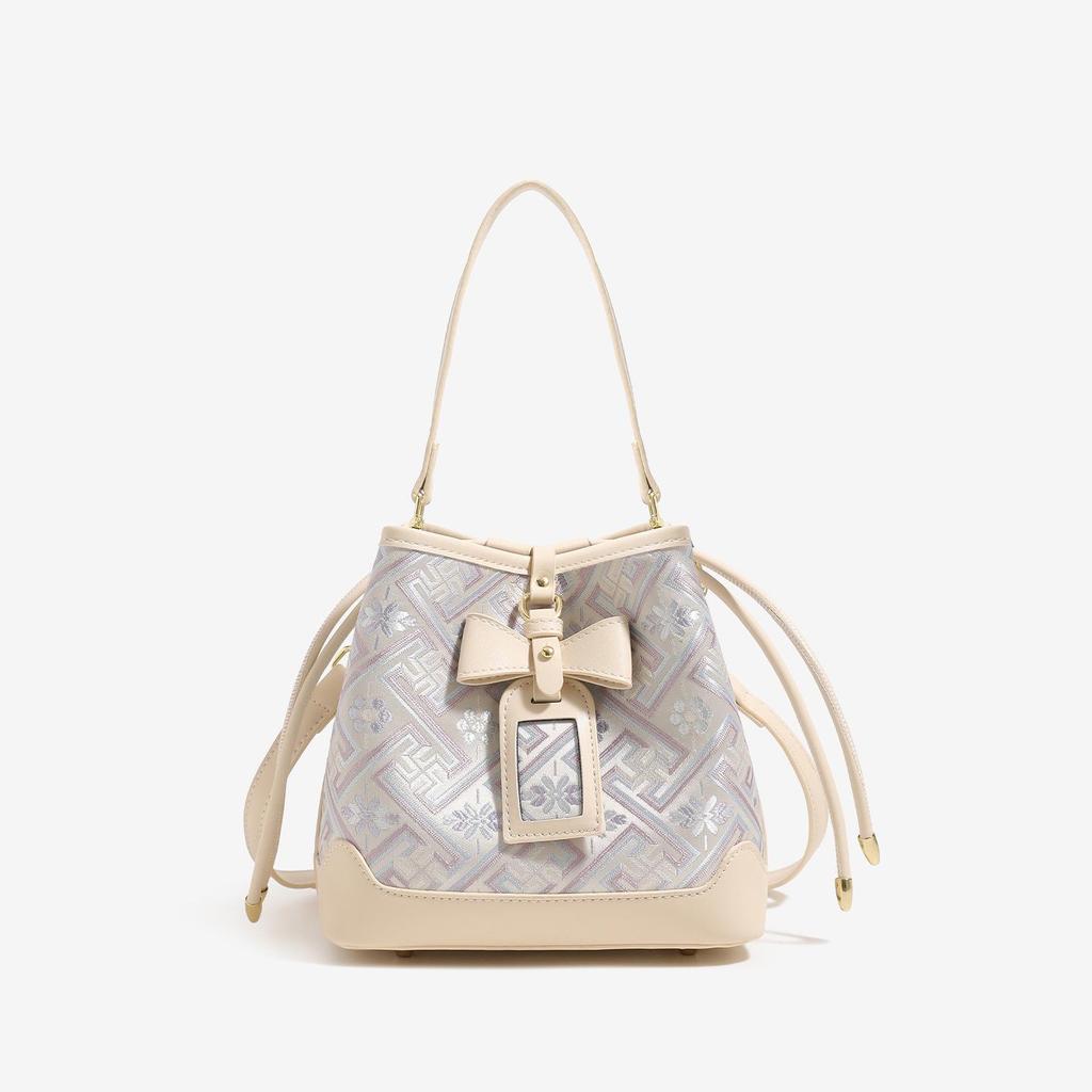 Guangxi Zhuang Brocade Heritage Women's Bow Drawstring Bag - 2026 New Chinese Style Crossbody Bucket Bag