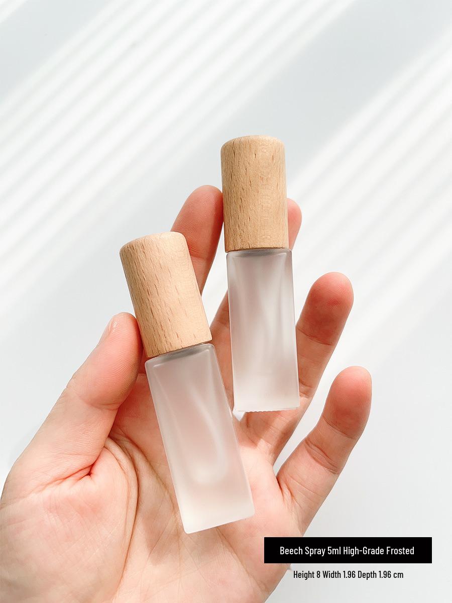 High-End 10ml Glass Perfume Refill Bottle with Wooden Lid and Portable Press Spray.