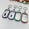 Ouvre-bouteille LED Multifonctionnel Mini Lampe de Poche Illuminée Porte-clés Pendentif