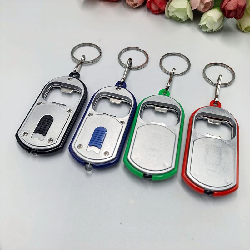 Ouvre-bouteille LED Multifonctionnel Mini Lampe de Poche Illuminée Porte-clés Pendentif