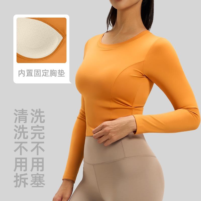 New Beautiful Back Yoga Clothes for Women Pleated Slim Fitness Tops with Built-in Chest Pads Running Sports Long Sleeves