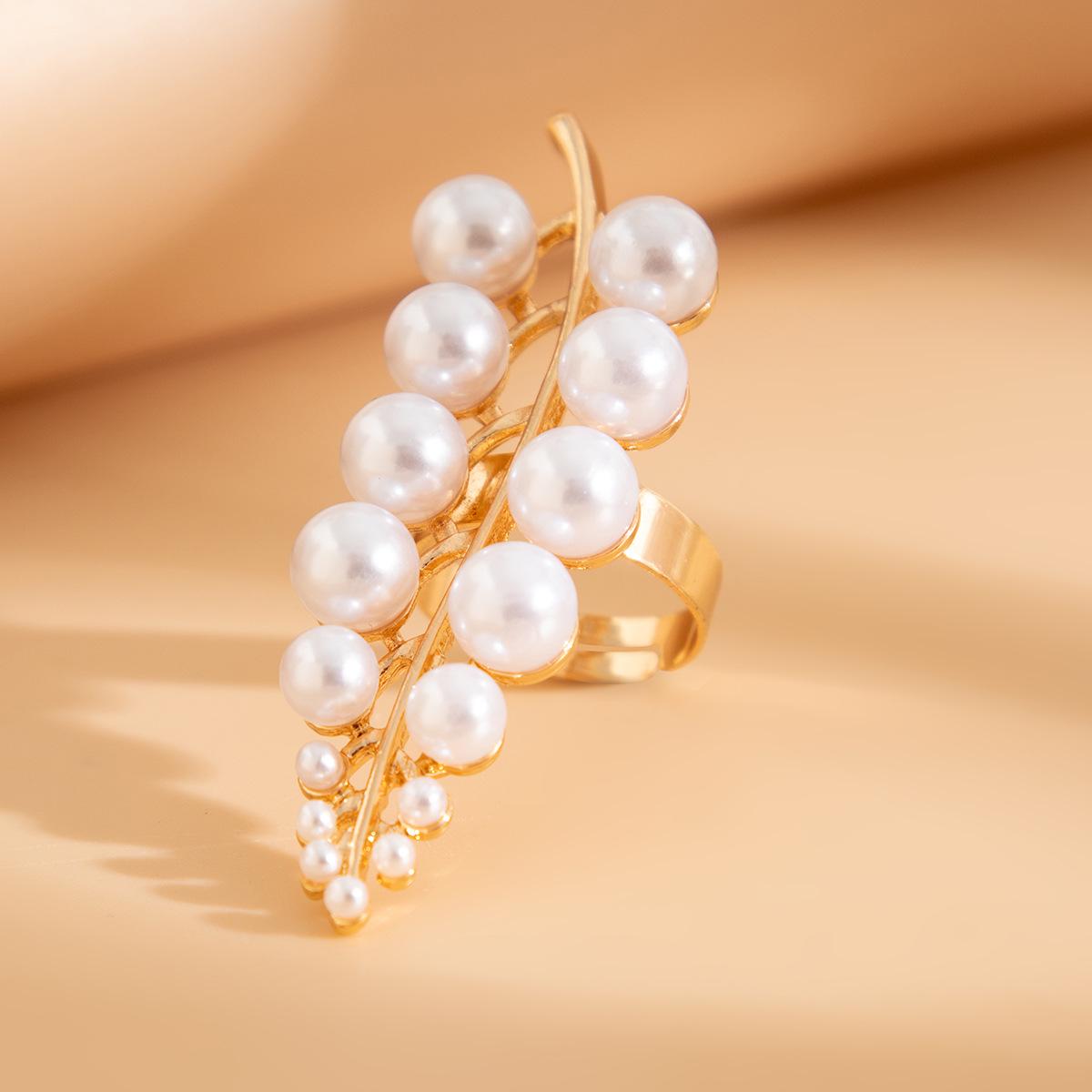 

Стильний нерегулярний набір кілець з сплаву та перлів, натхненний гілками