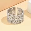 Elegant Hollowed Leaf Stainless Steel Ring: Artistic Retro Wide Band, Vacuum Gold Plated Jewelry for Women.