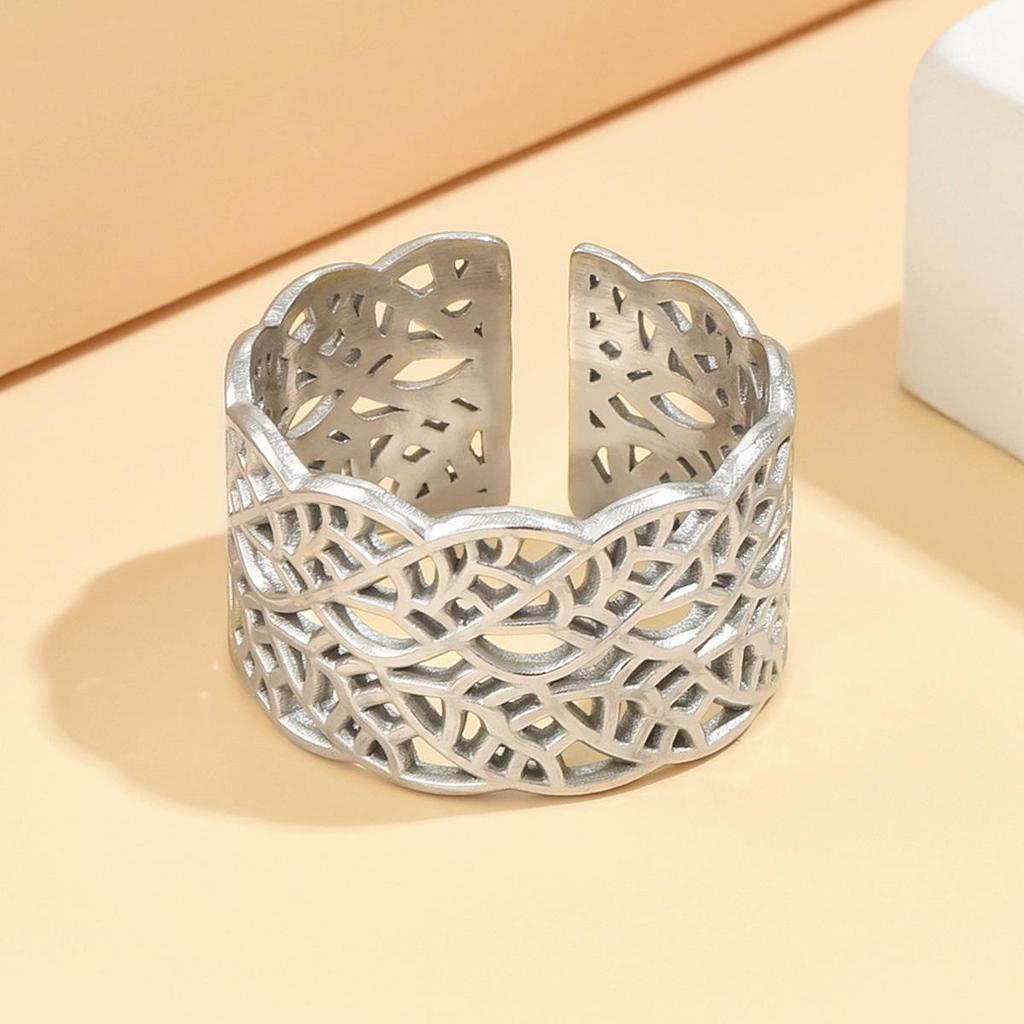 Elegant Hollowed Leaf Stainless Steel Ring: Artistic Retro Wide Band, Vacuum Gold Plated Jewelry for Women.