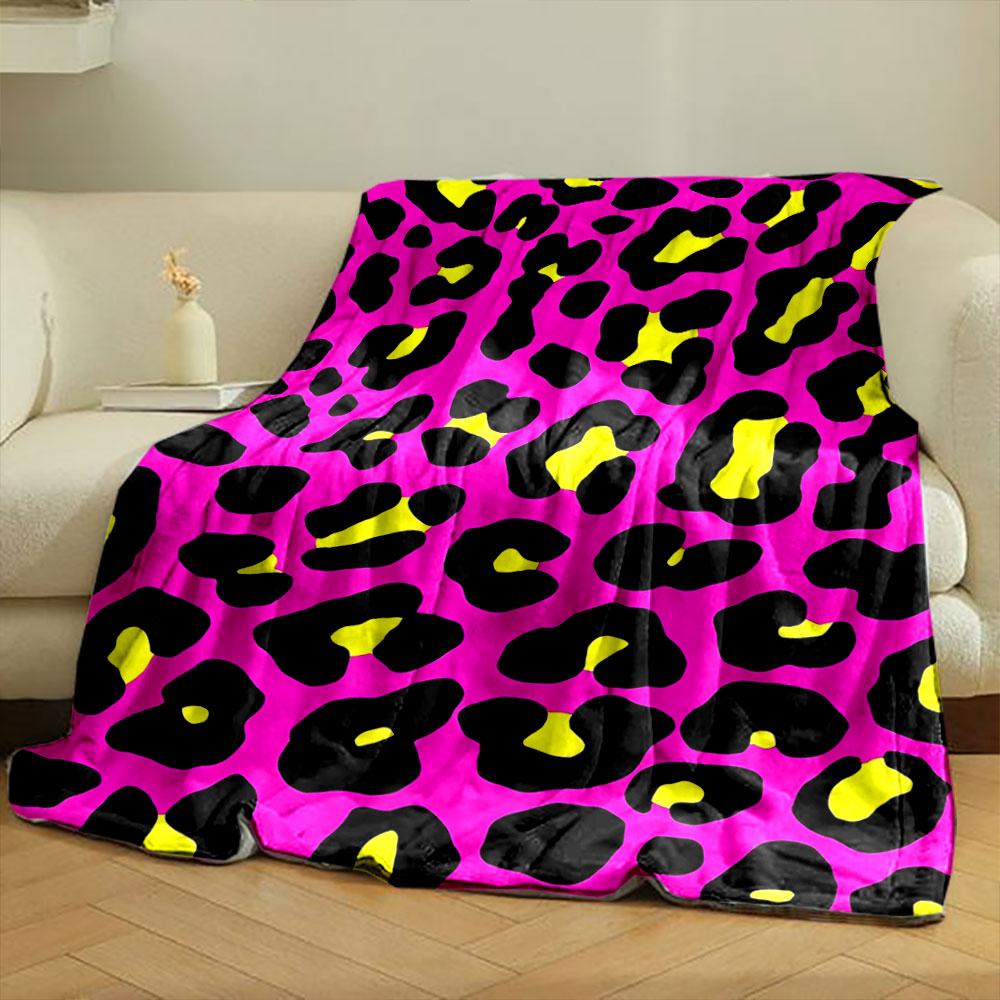 Bold leopard print with black spots, yellow centers, on a pink background. for all seasons blanket lunch break throw gift