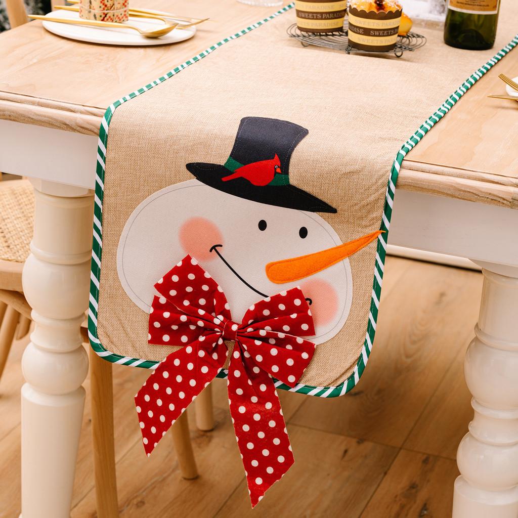 Charming Burlap Christmas Table Decor With Striped Edges Adorned With Whimsical Snowman And Characters Santa