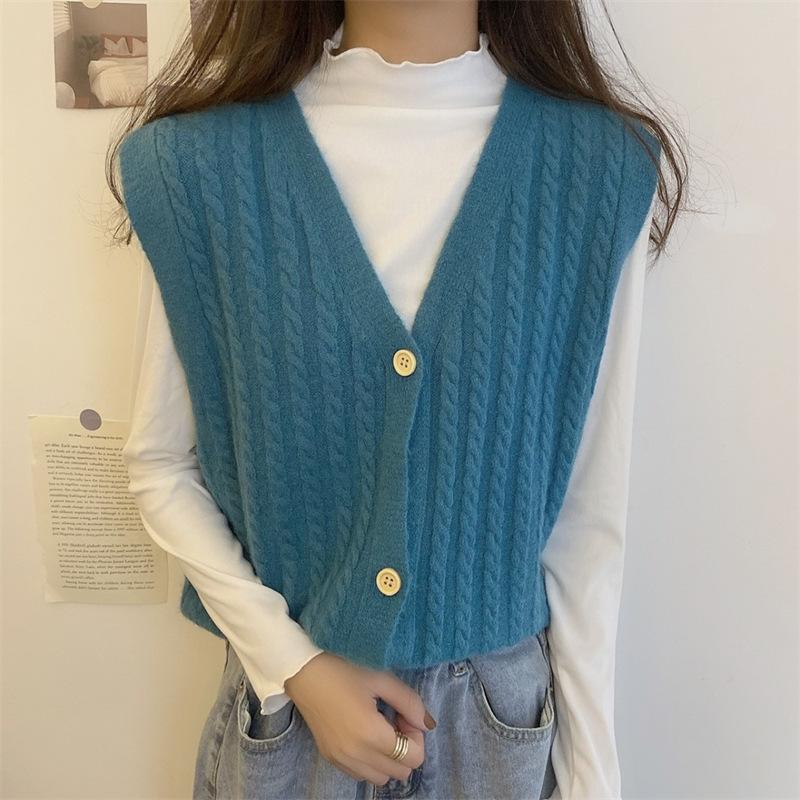 Knitted Vest, Short Top, Sleeveless Sweater Worn On Top A Small Woman with A Cardigan and A Camisole Shoulder