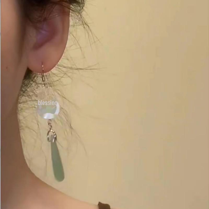 Chinese Jade Moon Tassel Earrings: Unique Design & Elegant Trend
