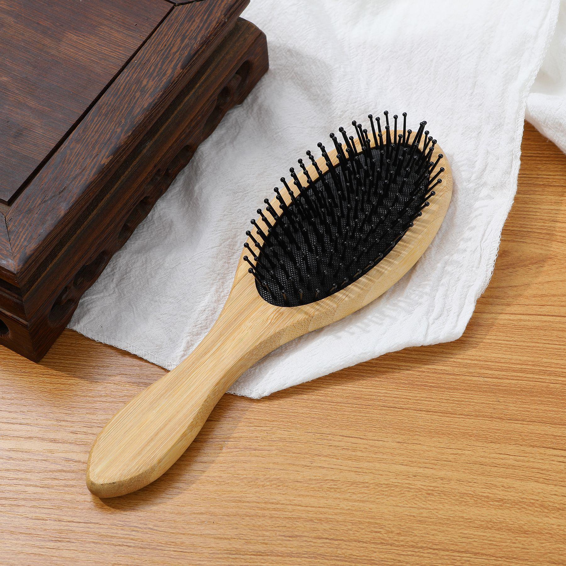 

Портативная деревянная массажная расческа с нейлоновой щетиной и воздушной подушкой на головке