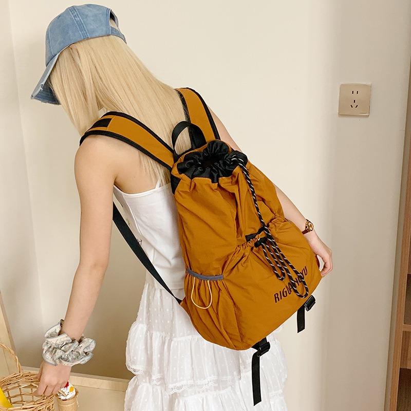 New schoolbag riding lightweight college student travel backpack men's and women's backpack drawstring mountaineering