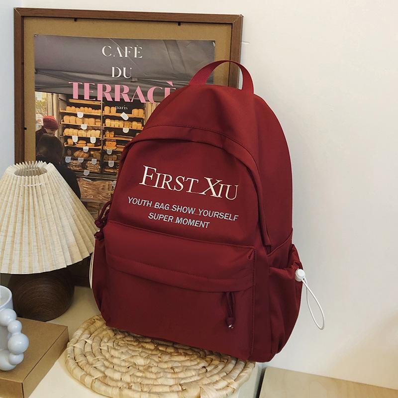 School bag Korean version ins style versatile junior high school student school bag solid color letter backpack high value simple lightweight backpack
