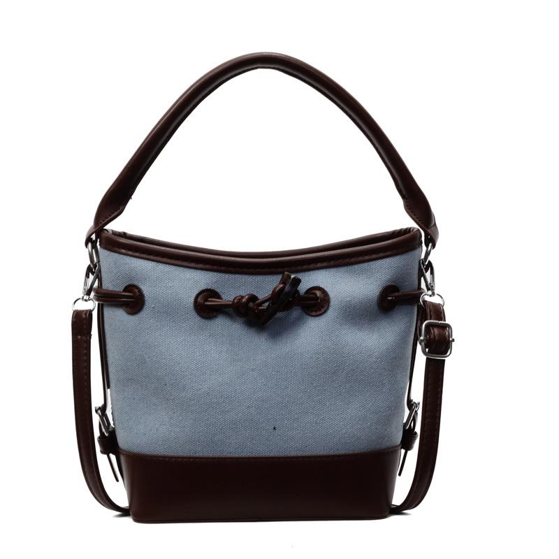 Niche design canvas splicing contrasting color bucket bag women's new portable commuter bag shoulder messenger bag