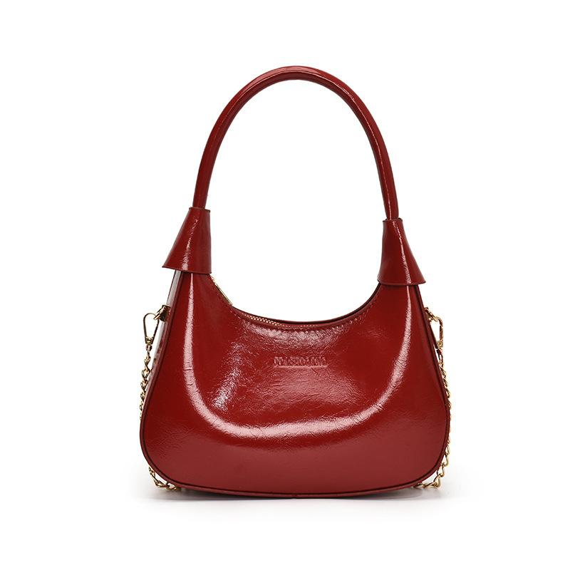 Fashion birth girl small bag 2025 new patent leather design sense portable crescent bag hand carry niche unique underarm bag