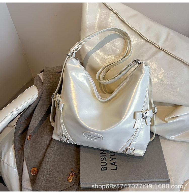 Koreanische Version von bow star schöne Tragetasche 2025 Frühling/Sommer neu modisch schlicht multifunktional Schulterrucksack