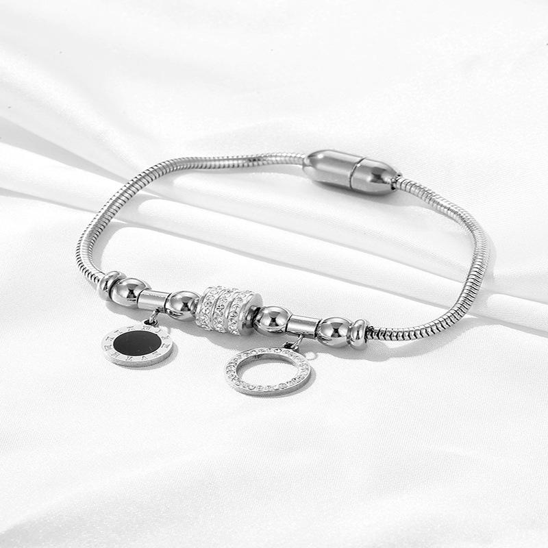 

Европейский и американский магнитный браслет с цирконом в виде круга - Нержавеющая сталь с бриллиантом, Титановая сталь, Перламутр и 18-каратное золото.