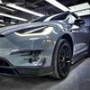 Tesla Model X RZ Carbon Fiber Body Kit: Front Lip, Modified Bumper, Rear Lip, Side Skirts.