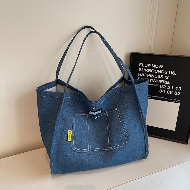 Einfache und großvolumige Denim-Canvas-Tragetasche Damen neue vielseitige Schultertasche tragbare Mode-Einkaufstasche Tide