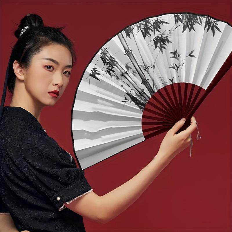 

An elegant Chinese silk folding fan - waterproof, tear resistant, portable and lightweight, designed with fabric shade material білий