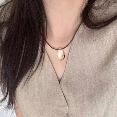 2025 New Style White Crystal Pendant Necklace for Women - Braided Rope Clavicle Chain, High-End Chinese Sweater Accessory.