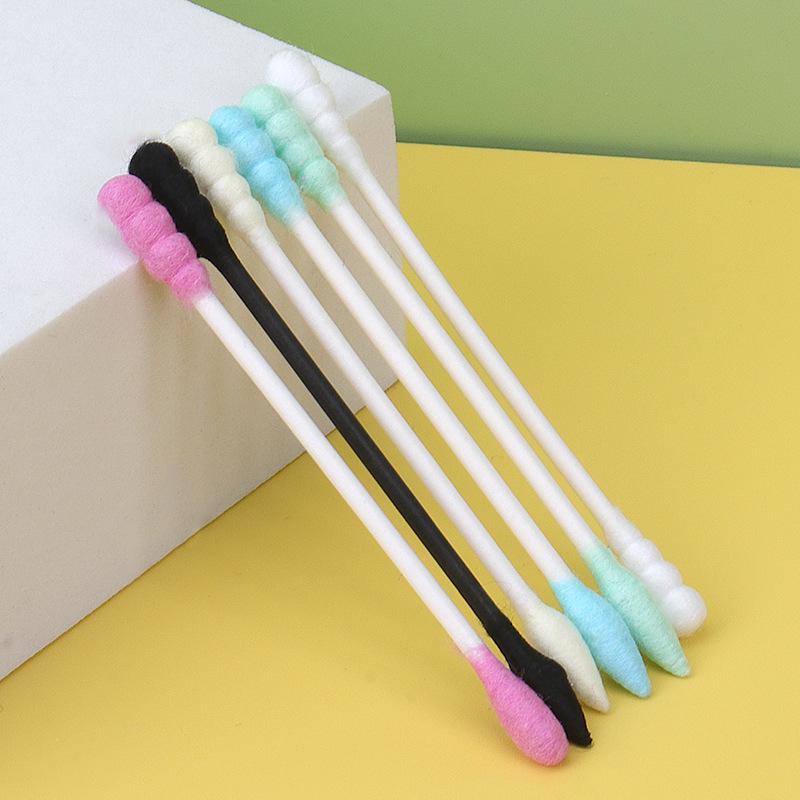 Pack of 100 double-ended, disposable cotton swabs with paper sticks for ear cleaning and makeup application.