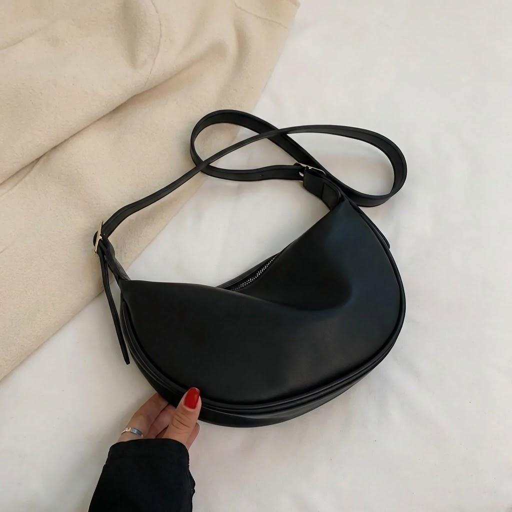 

Новая летняя мягкая кожаная сумка через плечо Популярная нишевая сумка-пельмень для повседневной носки чёрный
