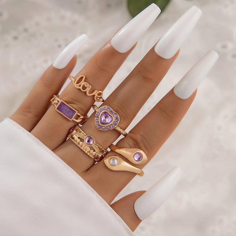 European and American new dripping butterfly imitation gemstone and diamond ring set Geometric twist ring seven-piece set