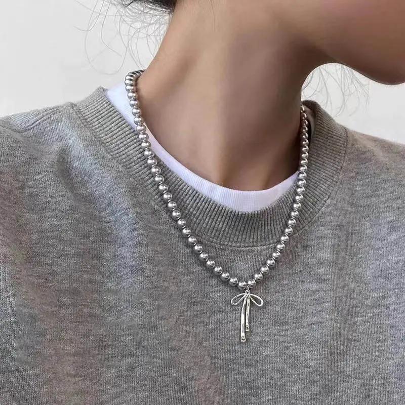Fashionable Choker with Pendant Graceful Bowknot Pendant Choker Necklace with Gray Pearls Neck Zircon Accessories