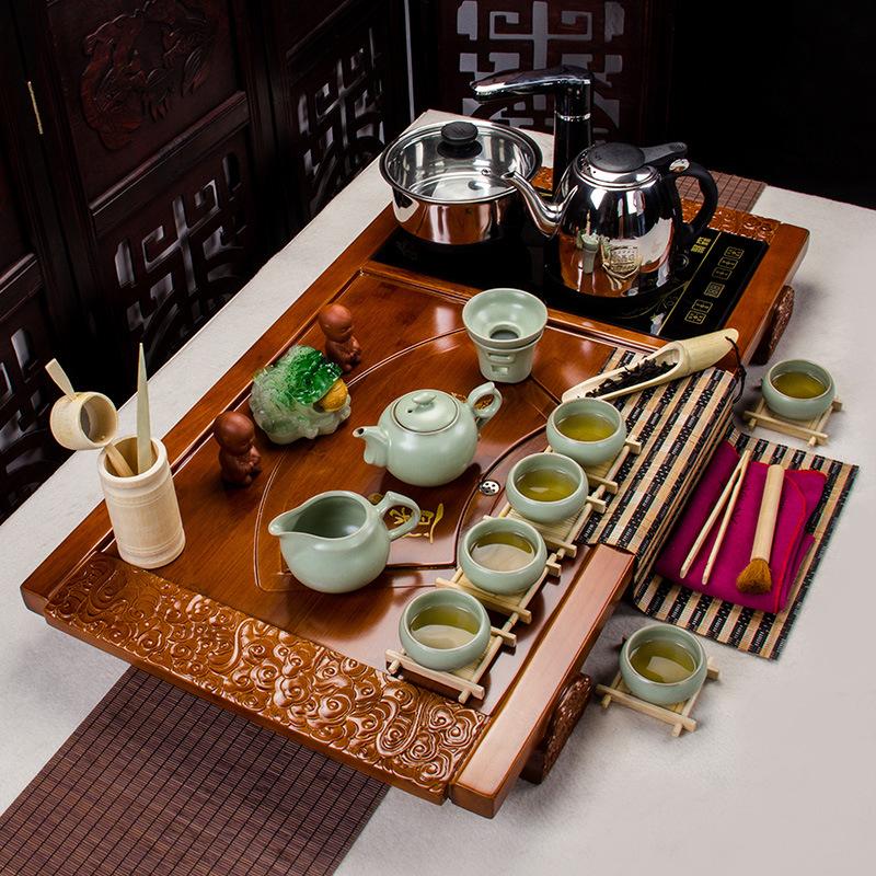Kung Fu čajový set Yixing akce čtyři v jednom elektromagnetická trouba Ru keramický křišťálový podnos z masivního dřeva