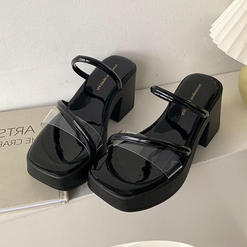 

Premium thick-soled slippers women s summer outer wear 2025 new thick-heeled one-word drag transparent high-heeled fairy wind sandals 35