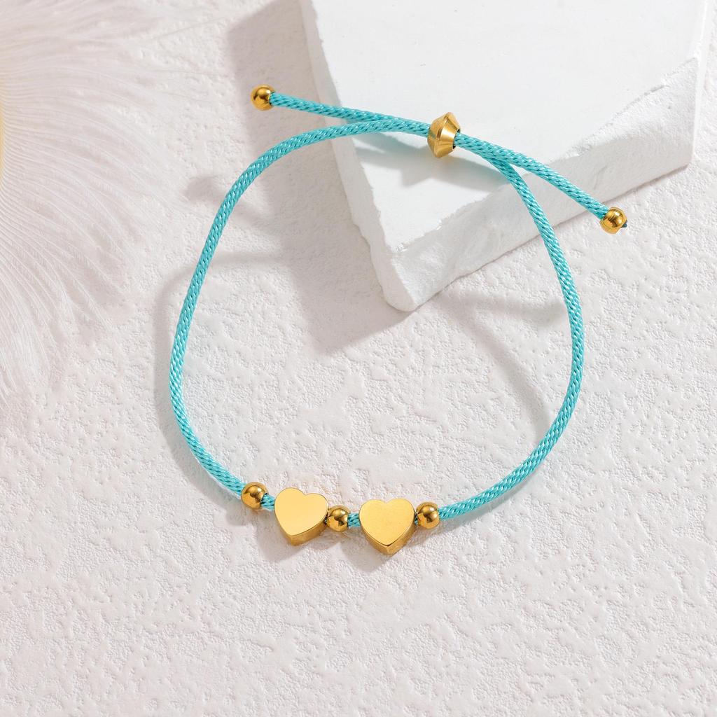 Minimalistisches blaues Seilarmband mit Herz-, Männchen- und runden Anhängern aus Edelstahl