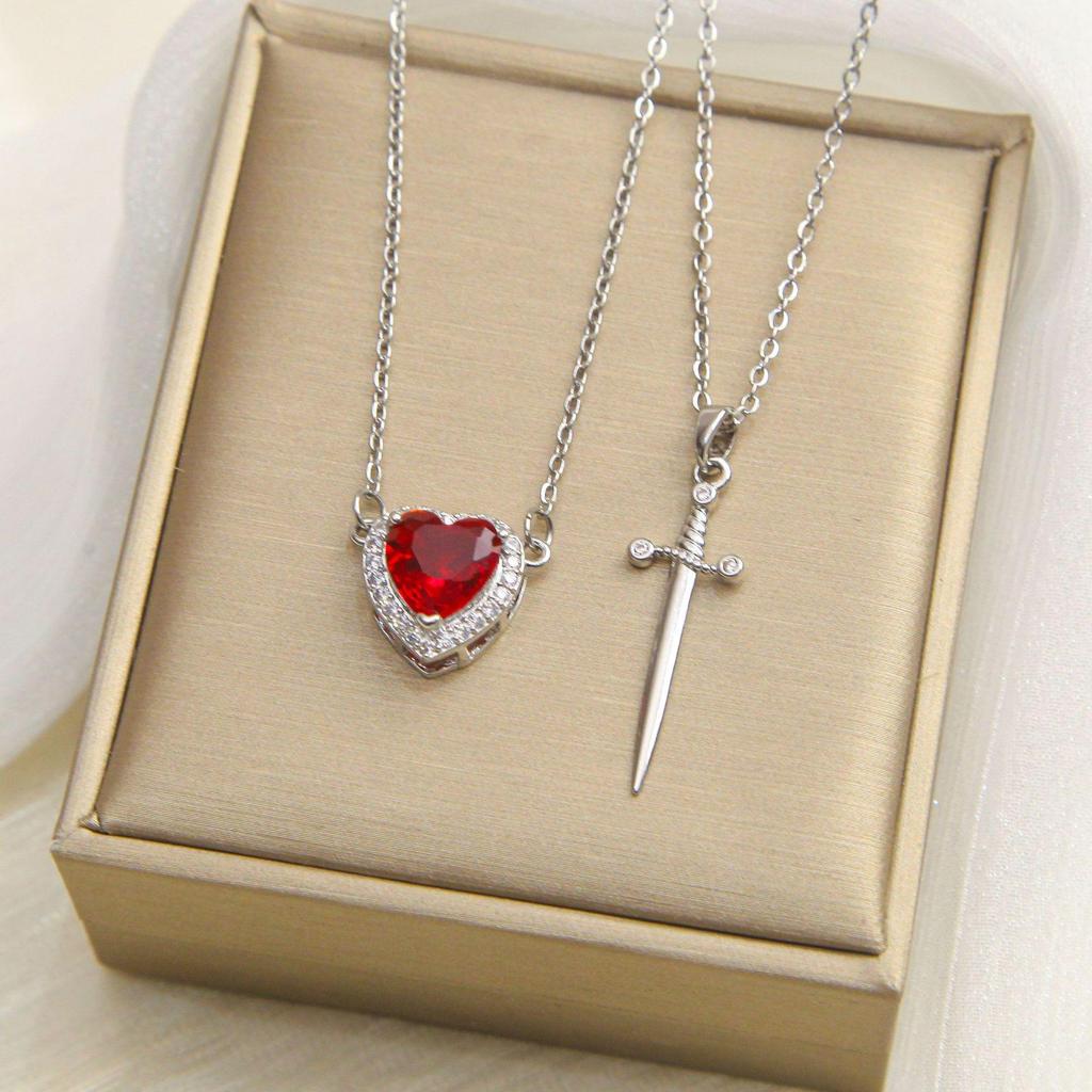 Titanium Steel Sword & Red Heart Necklace Set with Micro-Set Cubic Zirconia Arrow and Layered Clavicle Chain.