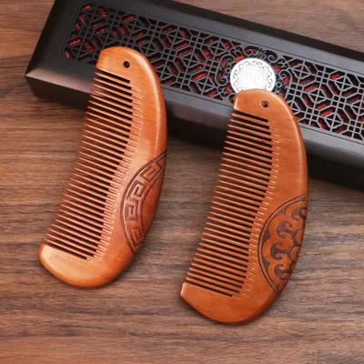 Double-Sided Carved Peach Wood Comb - Dense Teeth, Compact Size, Premium Solid Wood for Hairdressing.