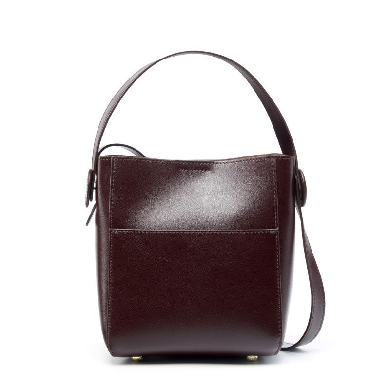 

New first-layer cowhide bag women s bucket bag design sense niche high-end leather commuting versatile women s messenger bag кавовий